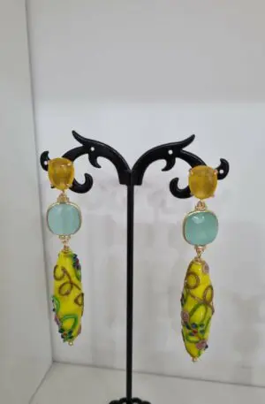 Earrings made with cat's eye and decorated blown glass