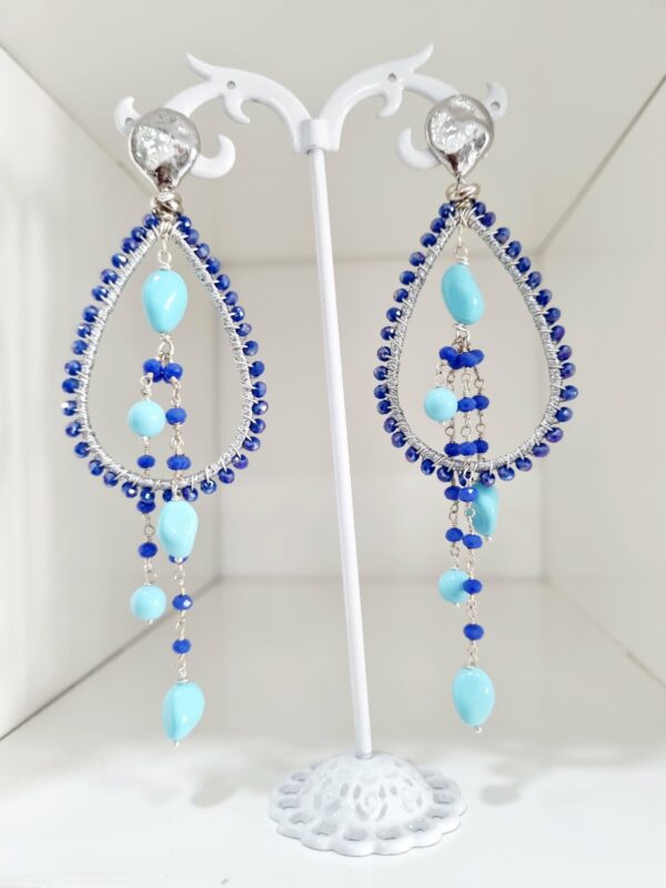 Earrings made with crystal and turquoise fabric. Silver-plated brass elements. Length 11cm Weight 8.2gr