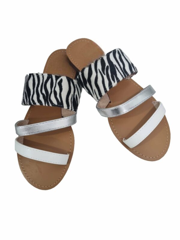Slippers with stripes in eco-leather and zebra-print suede. Rise 1.5 cm