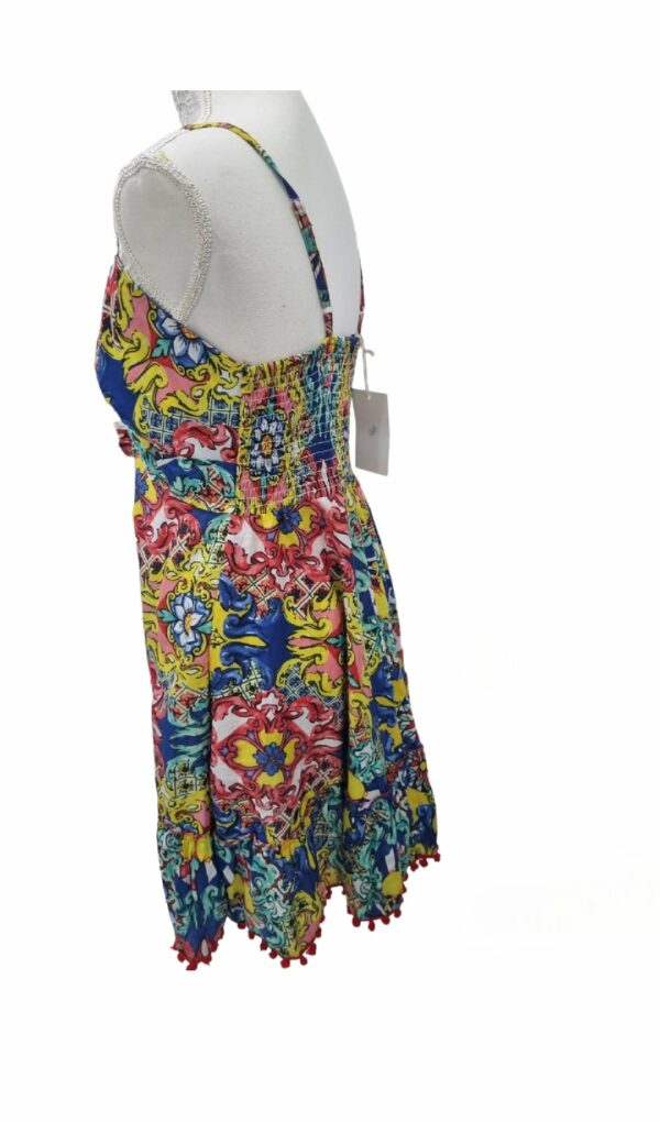 Short 100% cotton dress with adjustable straps, elasticated back and pom pom ends. One size Rosalia women's pattern