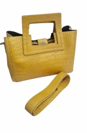 Genuine leather bag, made in Italy, ocher yellow colour, equipped with shoulder strap, three internal compartments with side pockets, removable central bag. closure with magnetic button. Square handle. Measurements L30 B11 H18