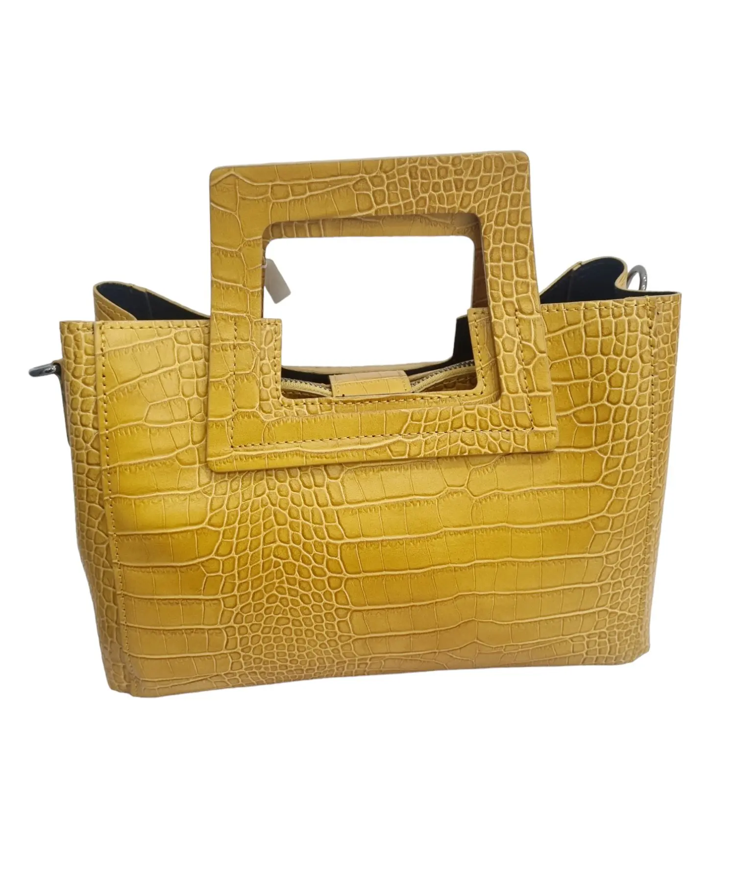 Genuine leather bag, made in Italy, ocher yellow colour, equipped with shoulder strap, three internal compartments with side pockets, removable central bag. closure with magnetic button. Square handle. Measurements L30 B11 H18