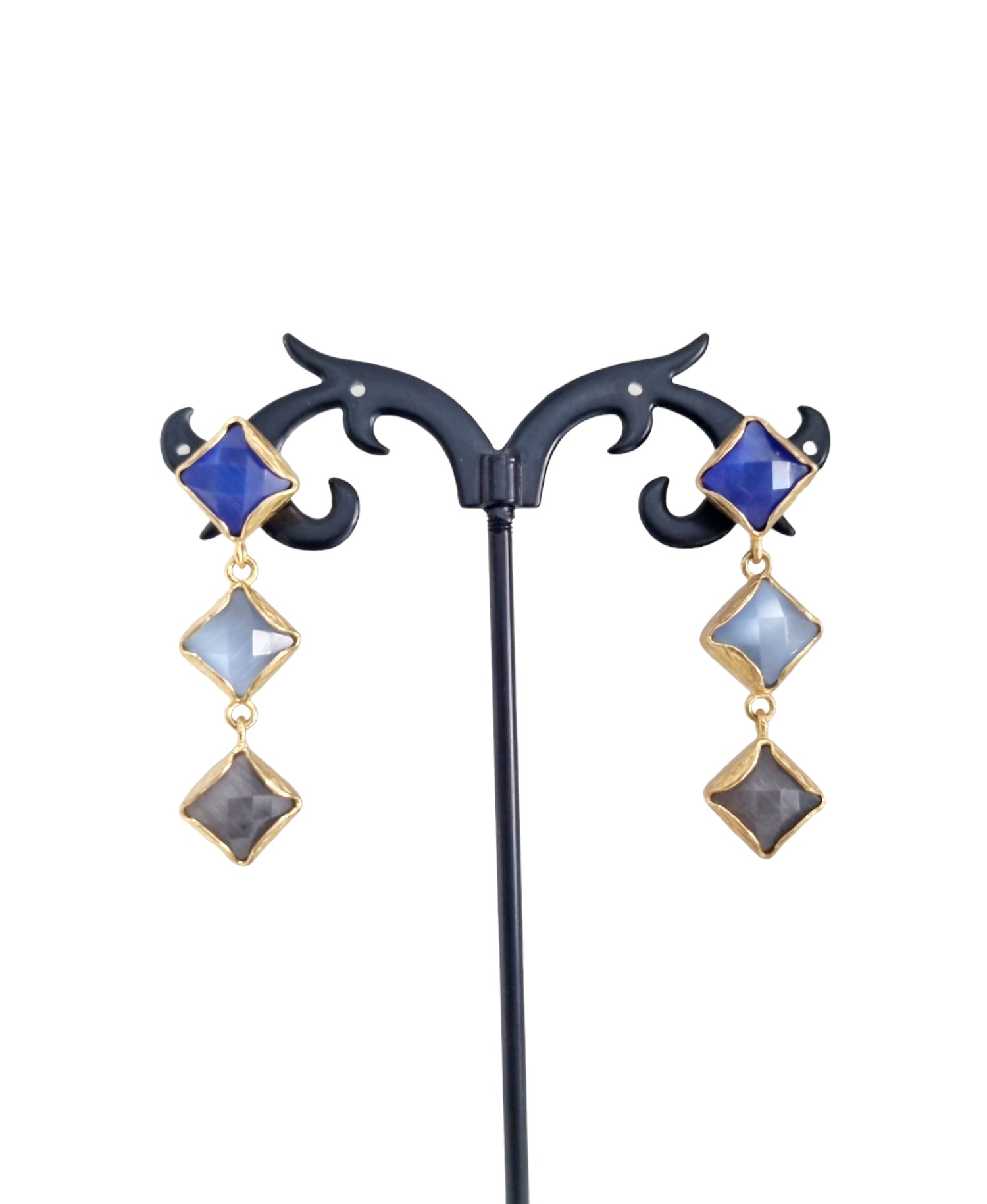 Earrings made with blue cat's eye, sugar paper and gray surrounded by brass. Weight 7.4g Length 4.5cm