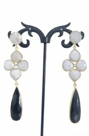 Earrings made with onyx and moonstone surrounded by brass. Length 7.5cm Weight 6.9gr