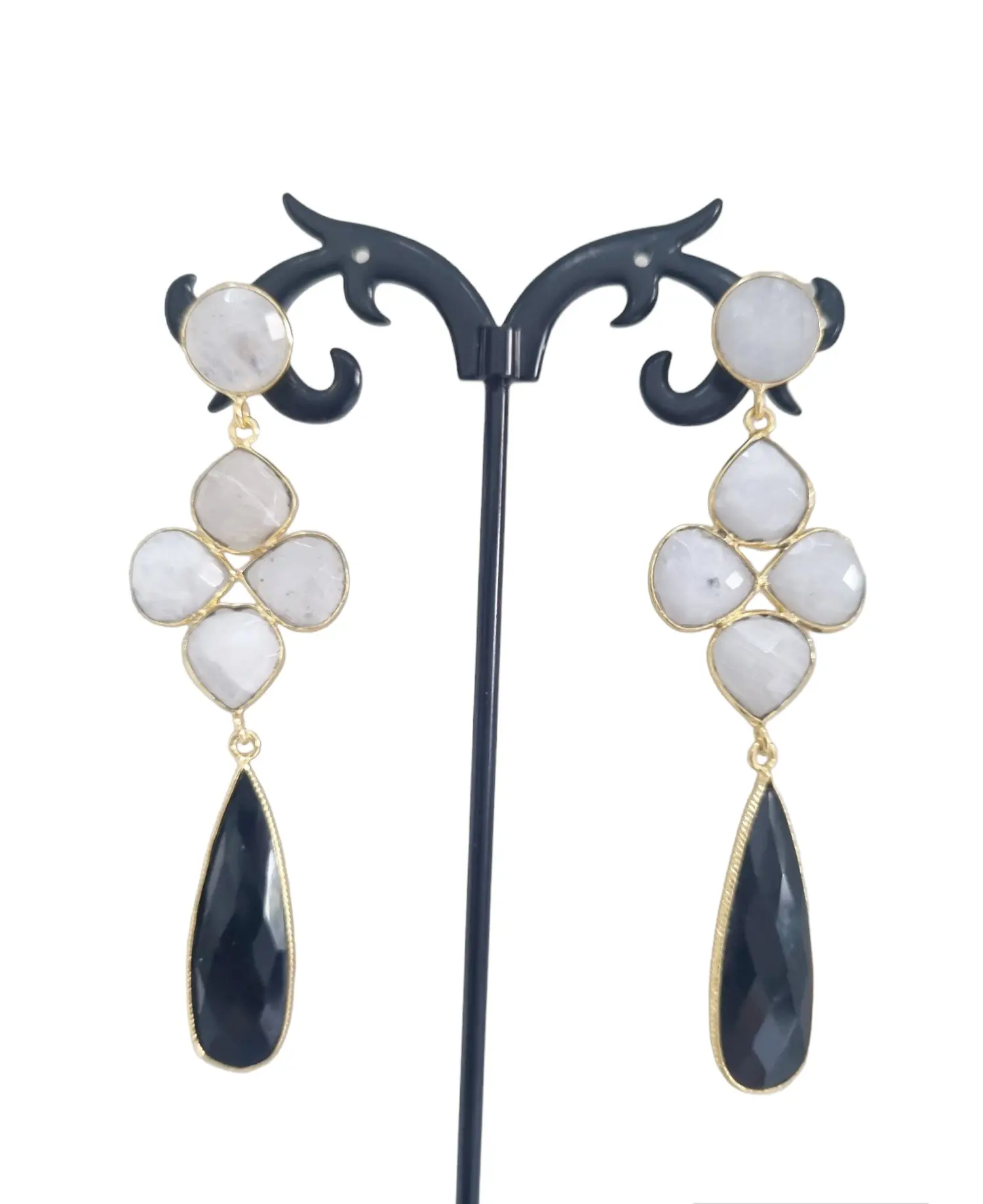 Earrings made with onyx and moonstone surrounded by brass. Length 7.5cm Weight 6.9gr