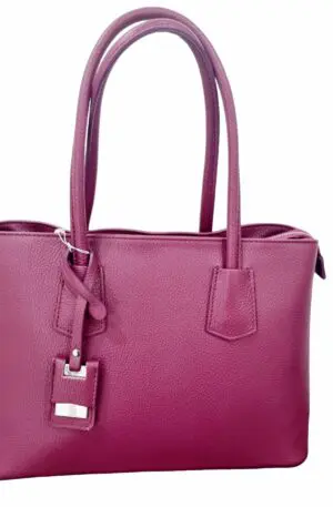 Genuine leather bag, made in Italy, with shoulder strap, wide handles, lined interior with three compartments, central zip and side pockets. cyclamen color measures L33 B15 H24 arm width 19cm