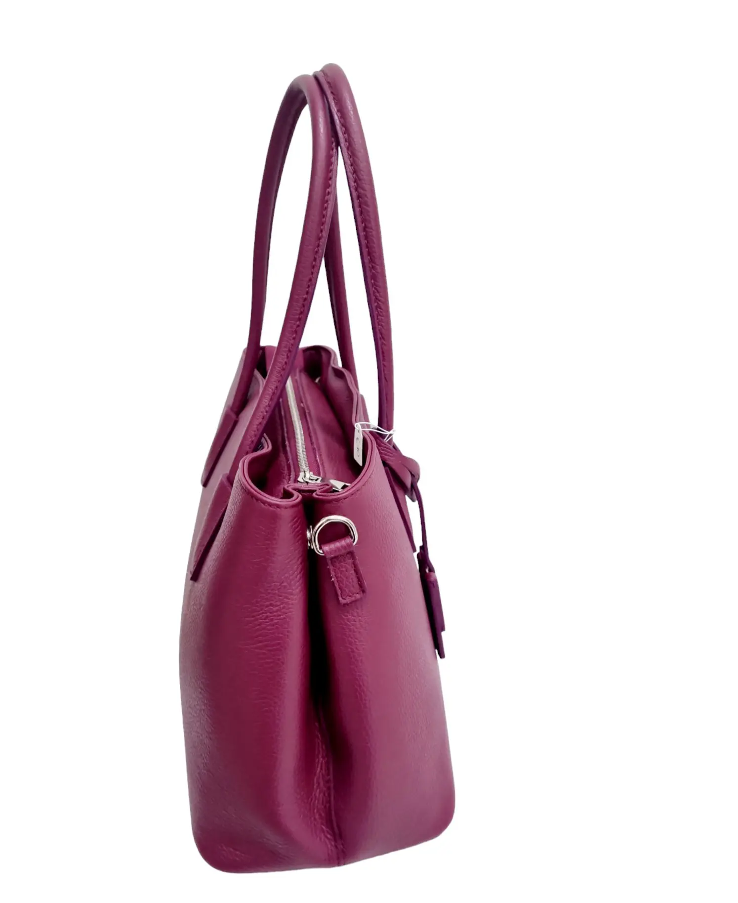 Genuine leather bag, made in Italy, with shoulder strap, wide handles, lined interior with three compartments, central zip and side pockets. cyclamen color measures L33 B15 H24 arm width 19cm