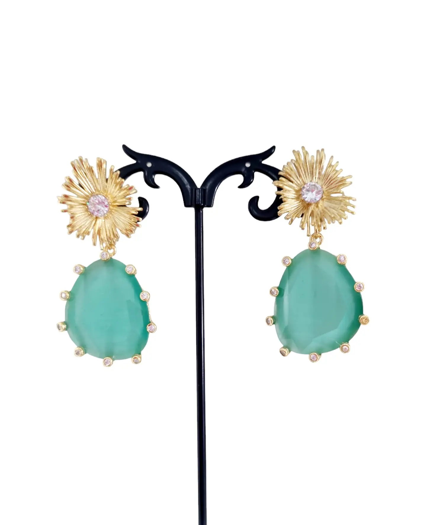 Earrings made with a cat's eye surrounded by brass and set zircons. Length 5cm Weight 12.3gr