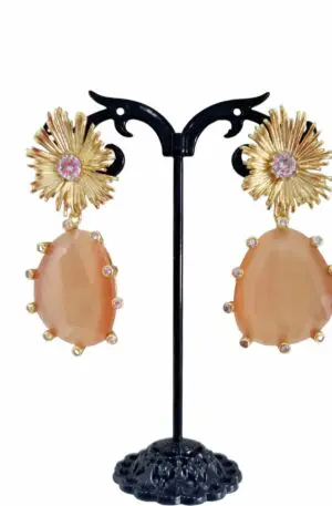 Earrings made with a cat's eye surrounded by brass and set zircons. Length 5cm Weight 12.9gr