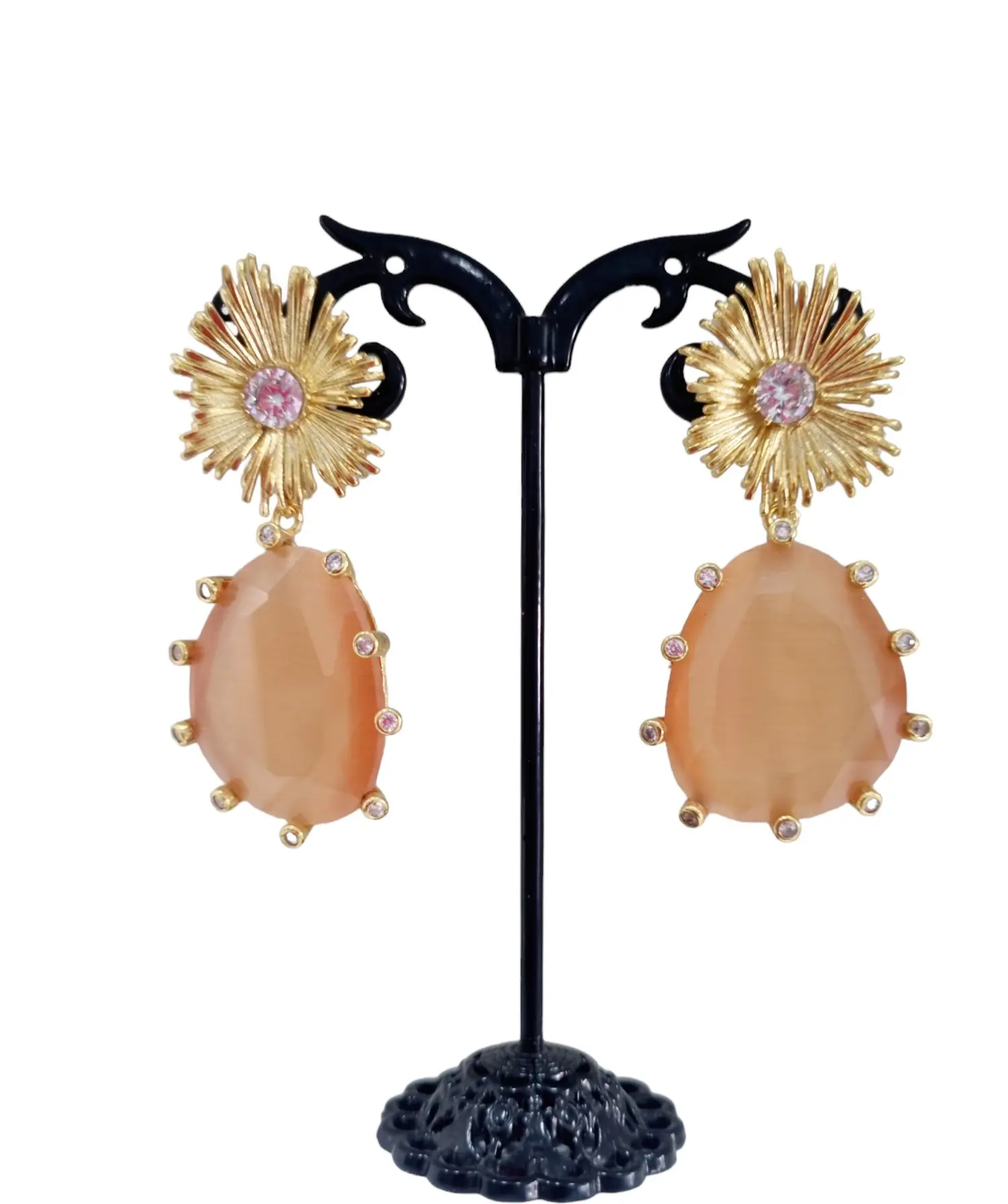 Earrings made with a cat's eye surrounded by brass and set zircons. Length 5cm Weight 12.9gr