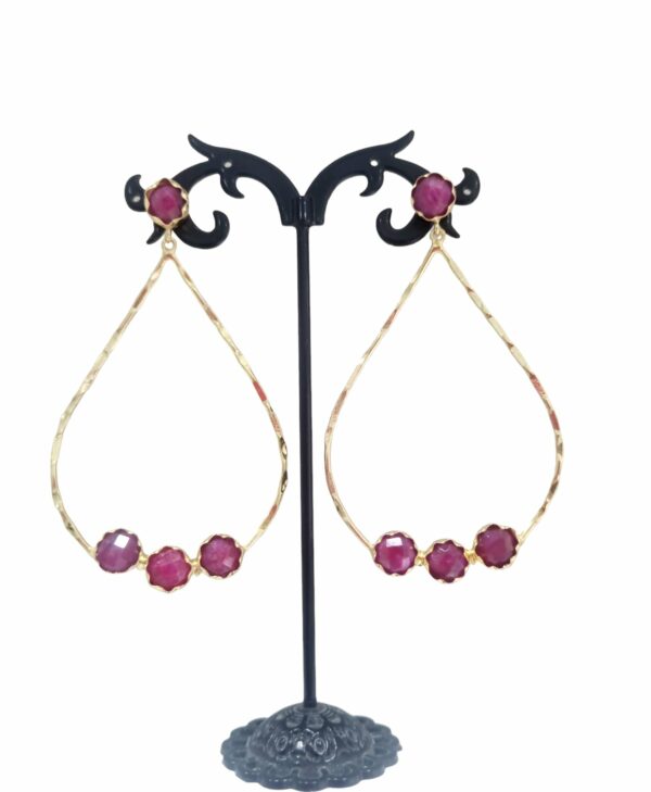 Earrings made with polished beaten brass and set with ruby root. Length 7.5cmWeight 5.7gr