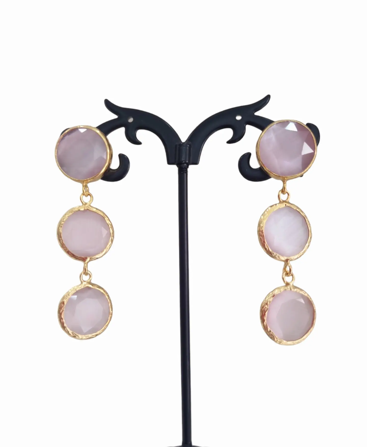 Earrings made with cat's eye surrounded by brass. Powder pink color Length 5cm Weight 6.2gr