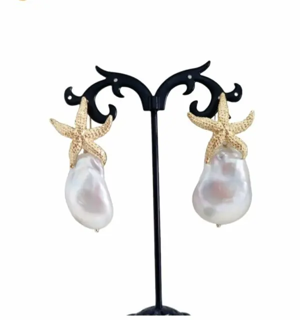 Earrings made with a star in 925 gold-plated silver and a large scaramzza pearl. Length 5 cm Weight 13.3gr Free shipping