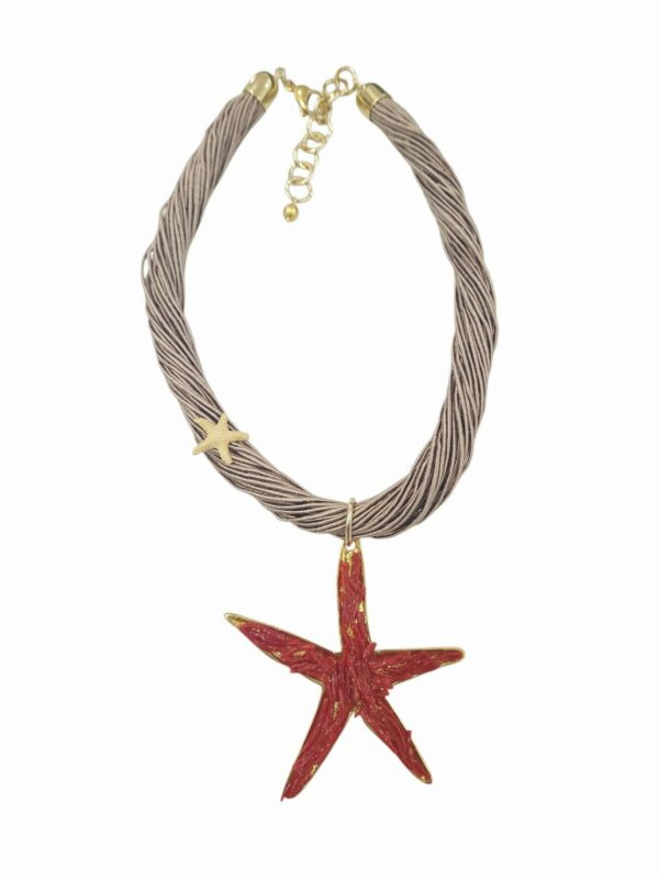 Collana girocollo realizzata con tessuto e stella innottone con corallo.lunghezza 47cmlunghezza stella 8cm Spedizione Gratuita