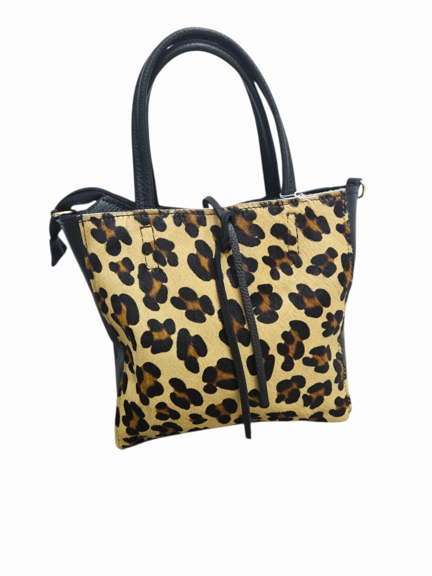 Borsa realizzata in vera pelle e cavallino maculato ,made Italy, chiusura con zip,interno nudo con borsellino estraibile e tracolla.Misure H24 B7 L28 Spedizione Gratuita