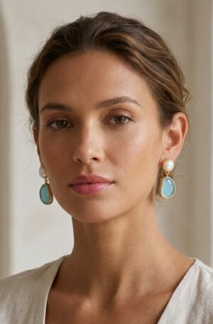 Orecchini  realizzati su base in ottone con occhio di gatto celeste e perle di fiume a lobo con ago e farfalla
peso 3.9gr
lunghezza 2.5cm Spedizione Gratuita