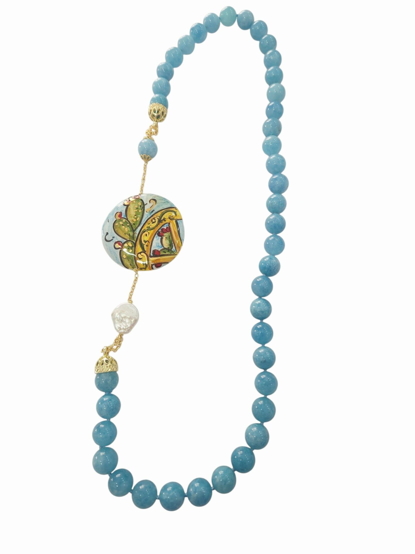 Collanq realizzat con calcedonio e laterale con perla barocca piatta e ceramica di Caltagirone dipinta
lunghezza 75cm Spedizione Gratuita Collanq realizzat con calcedonio e laterale con perla barocca piatta e ceramica di Caltagirone dipinta
lunghezza 75cm Spedizione Gratuita