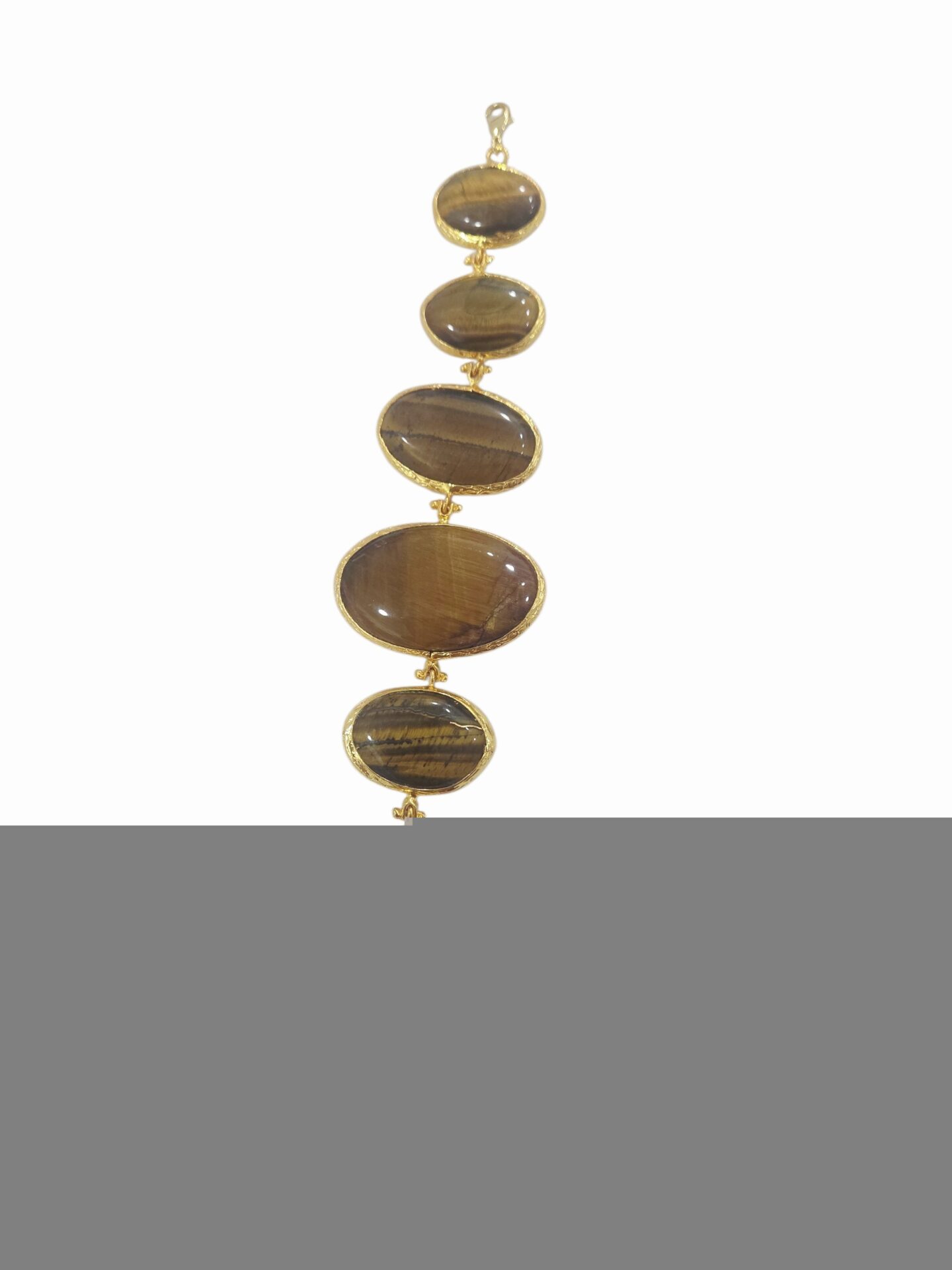 Bracciale regolabile realizzato con occhio di tigre ovale varie misure circondato da ottone.
lunghezza 22cm Spedizione Gratuita